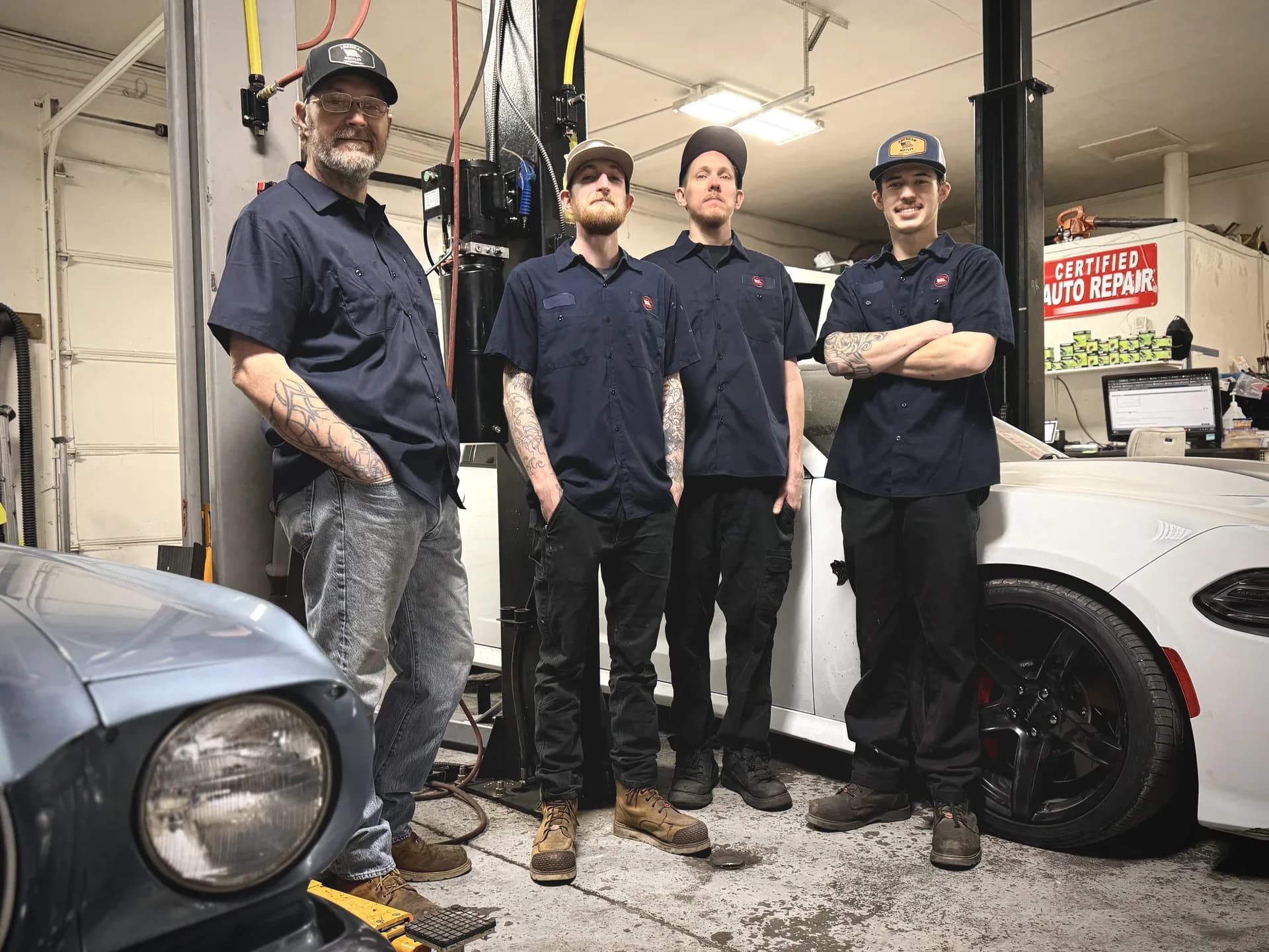 ase certified auto repair team with classic and modern vehicles