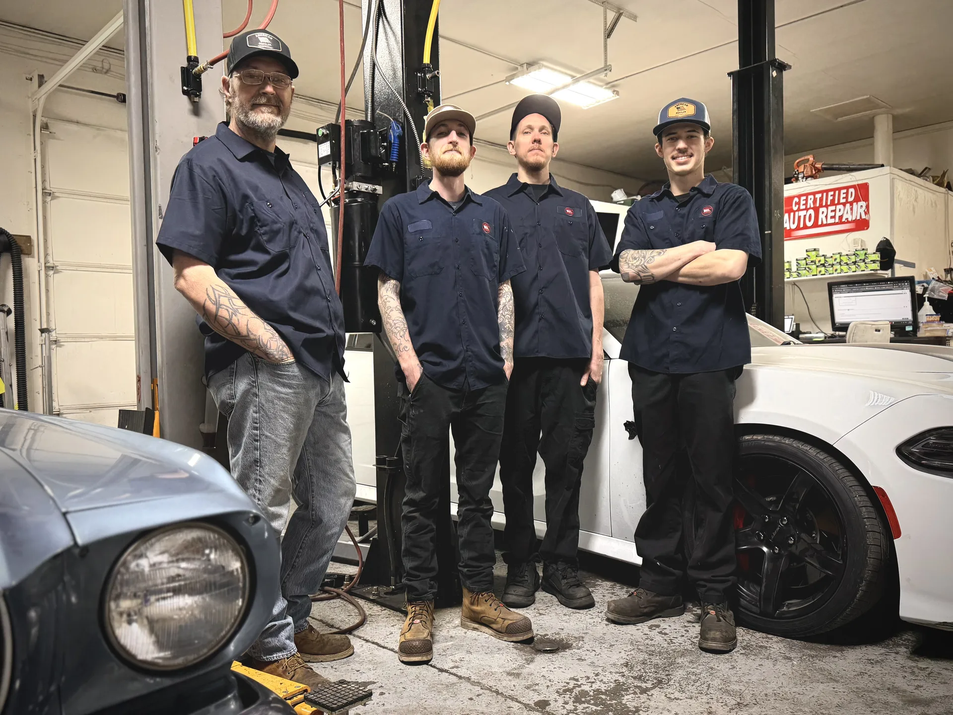 ase certified auto repair team with classic and modern vehicles