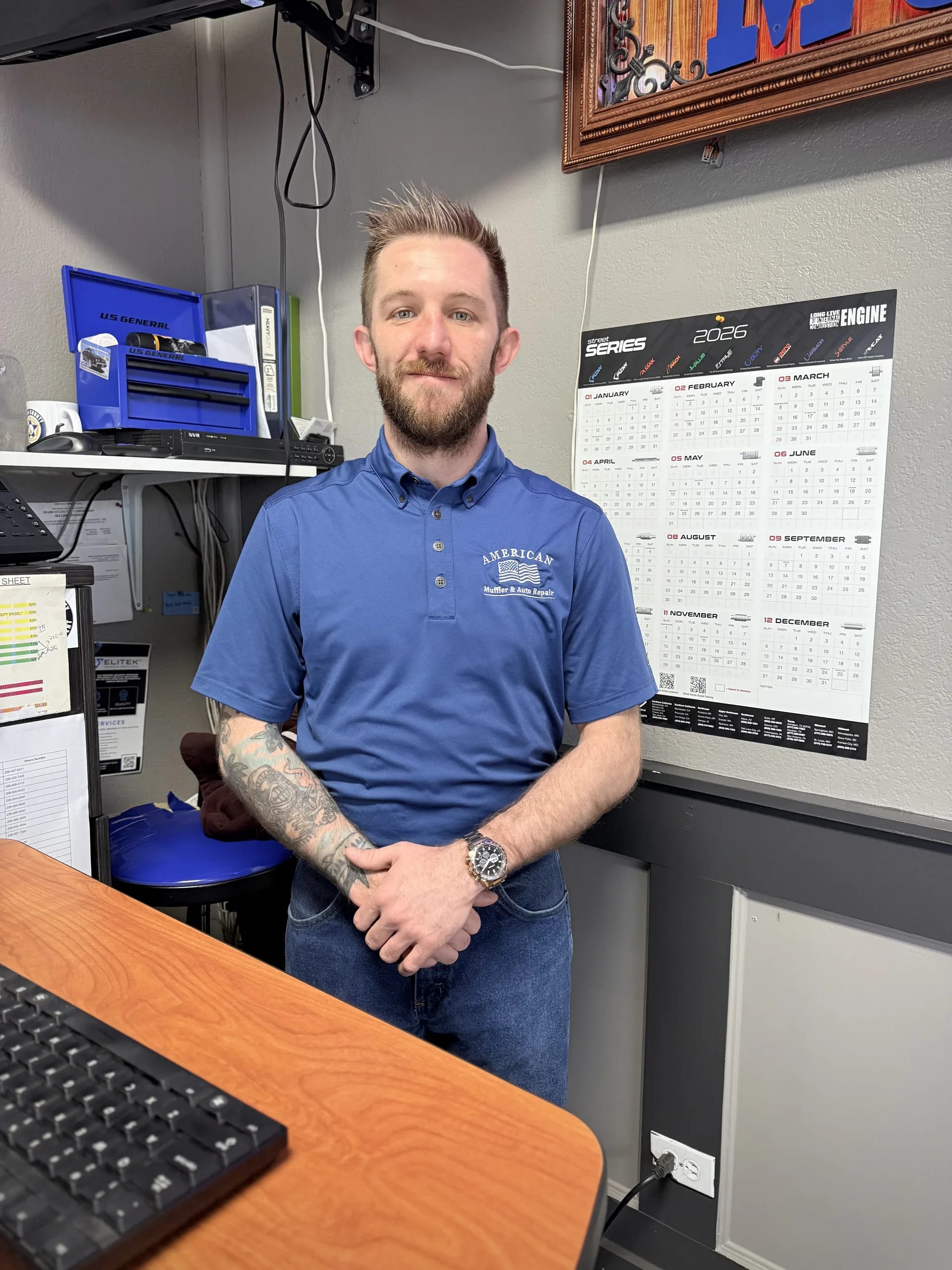 auto repair shop owner at front desk office