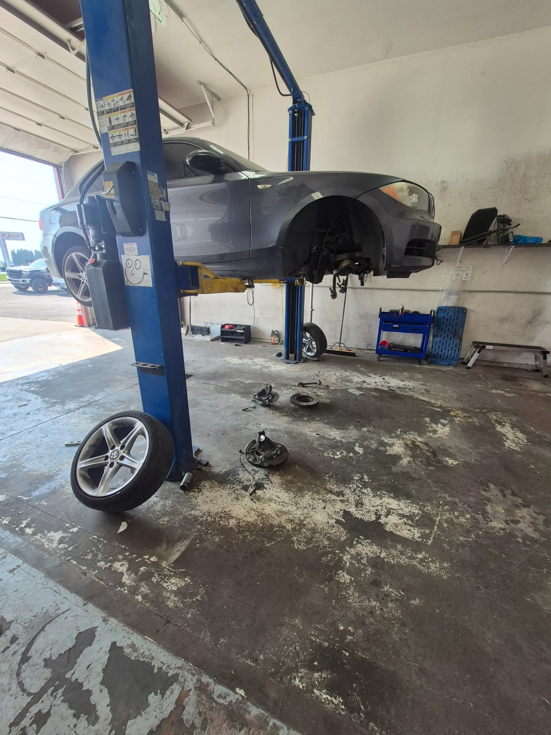 brake and suspension repair with vehicle raised on lift