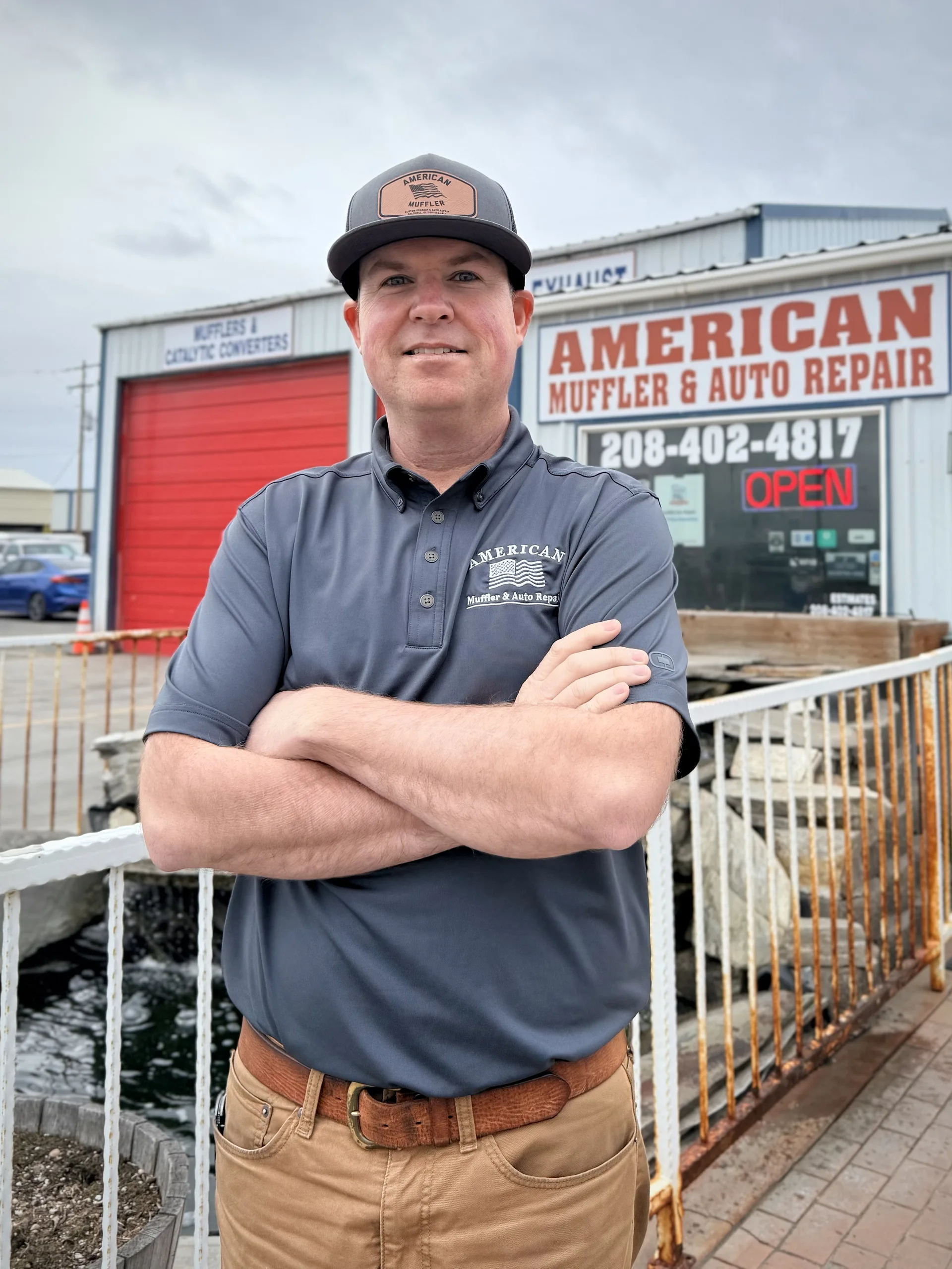 certified auto repair technician outside shop