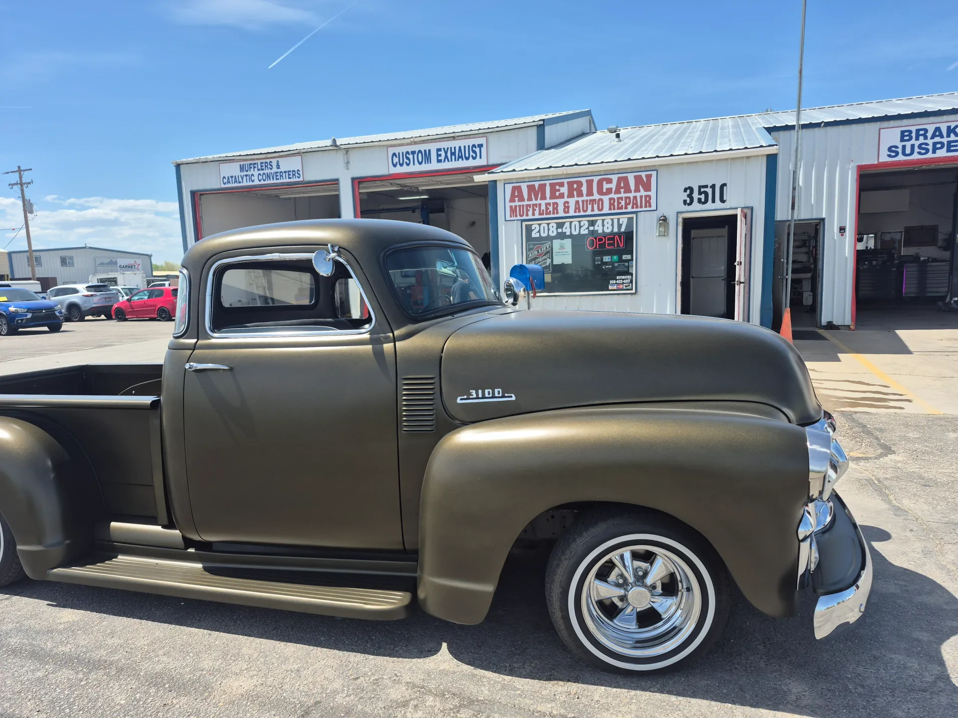 classic chevy pickup outside custom exhaust and brake repair shop