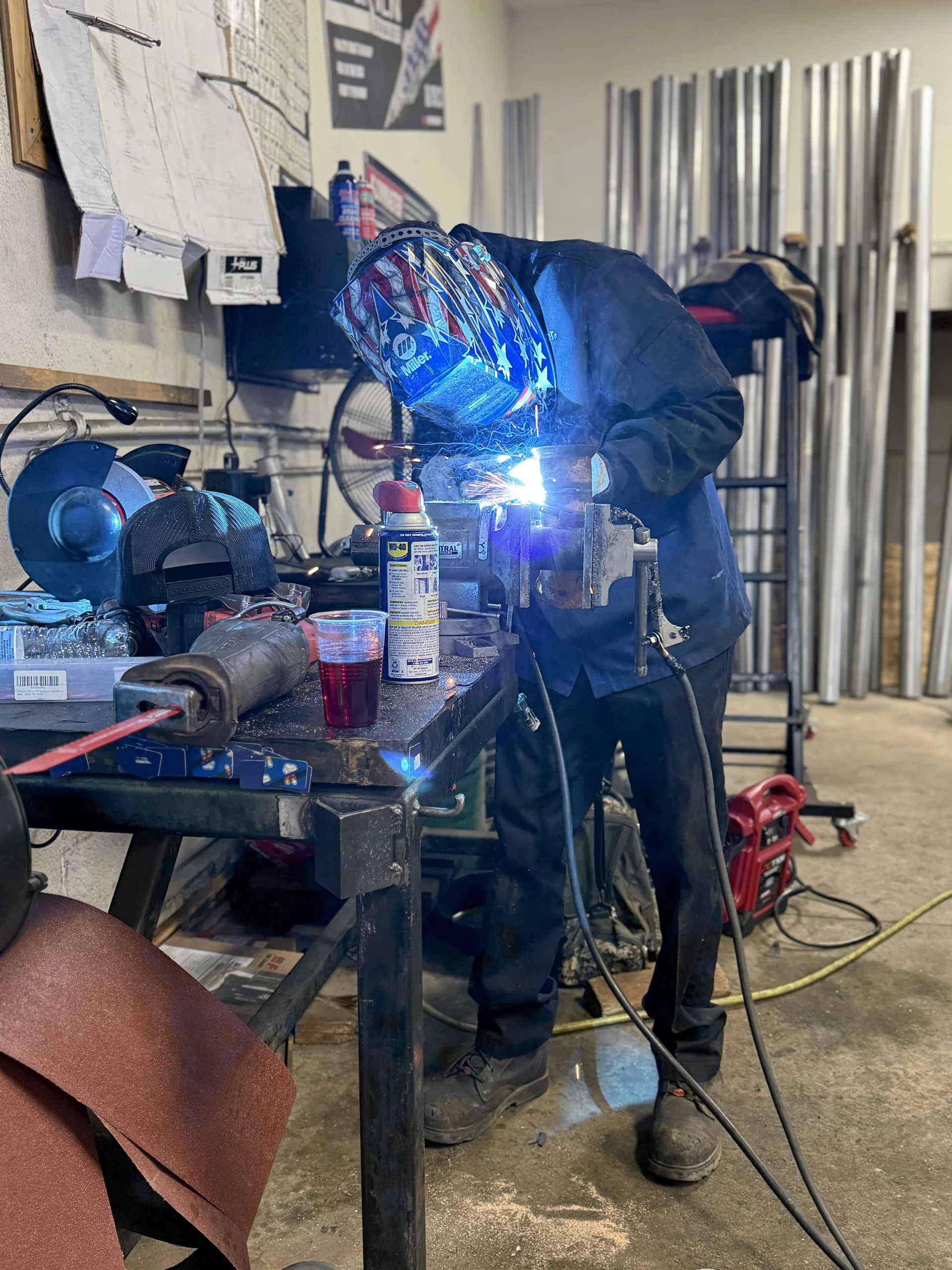 custom exhaust pipe welding in muffler shop work area