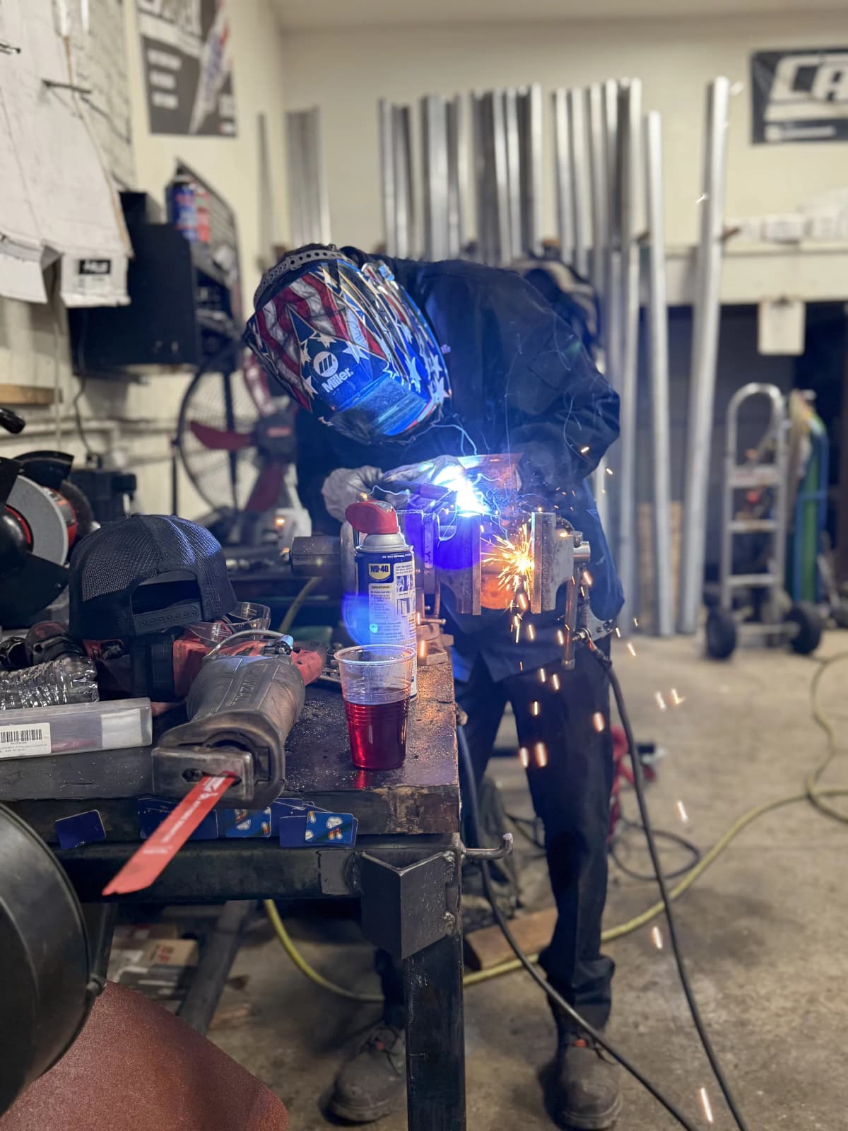 custom exhaust welding and muffler fabrication on workbench