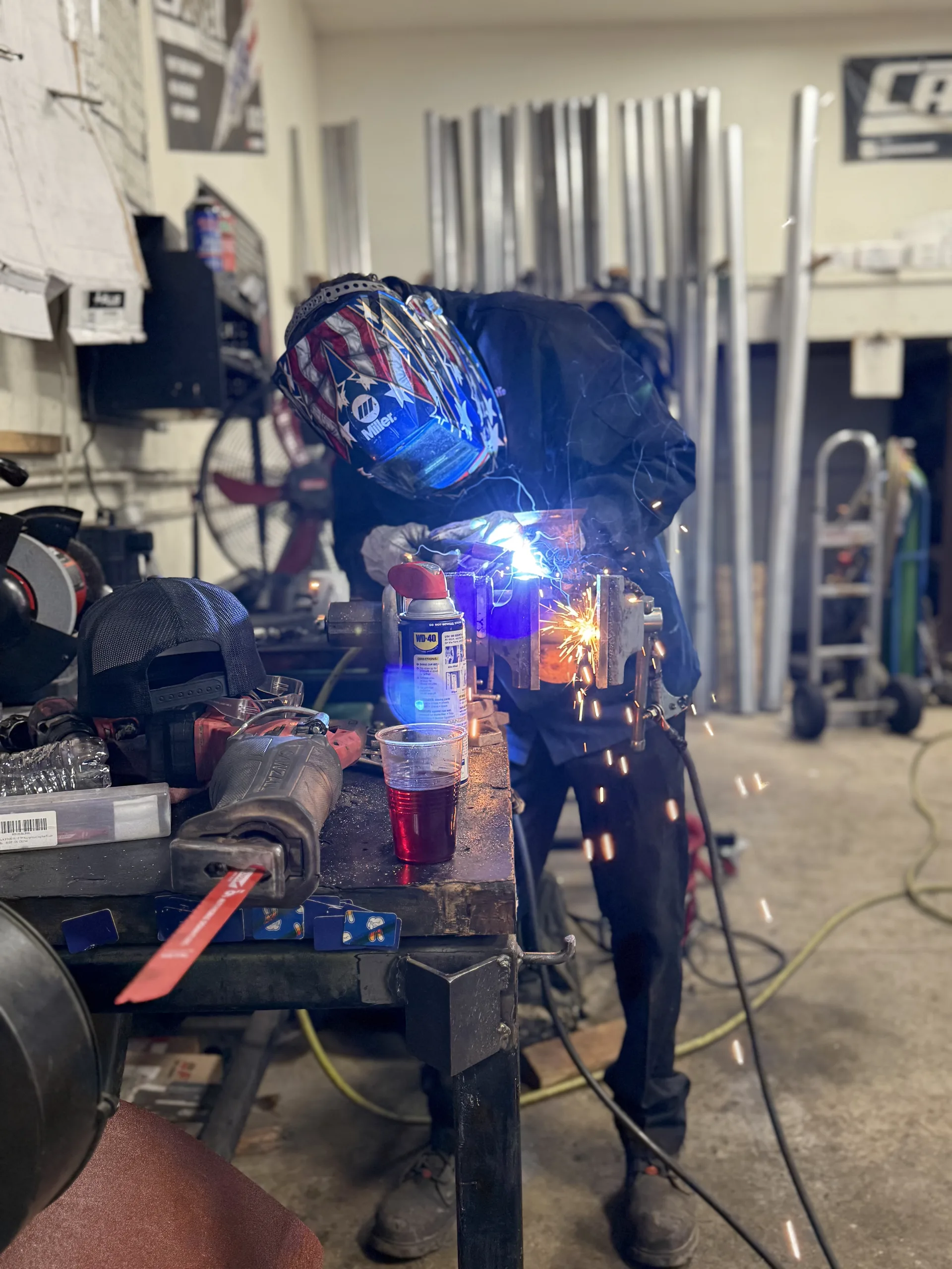 custom exhaust welding and muffler fabrication on workbench