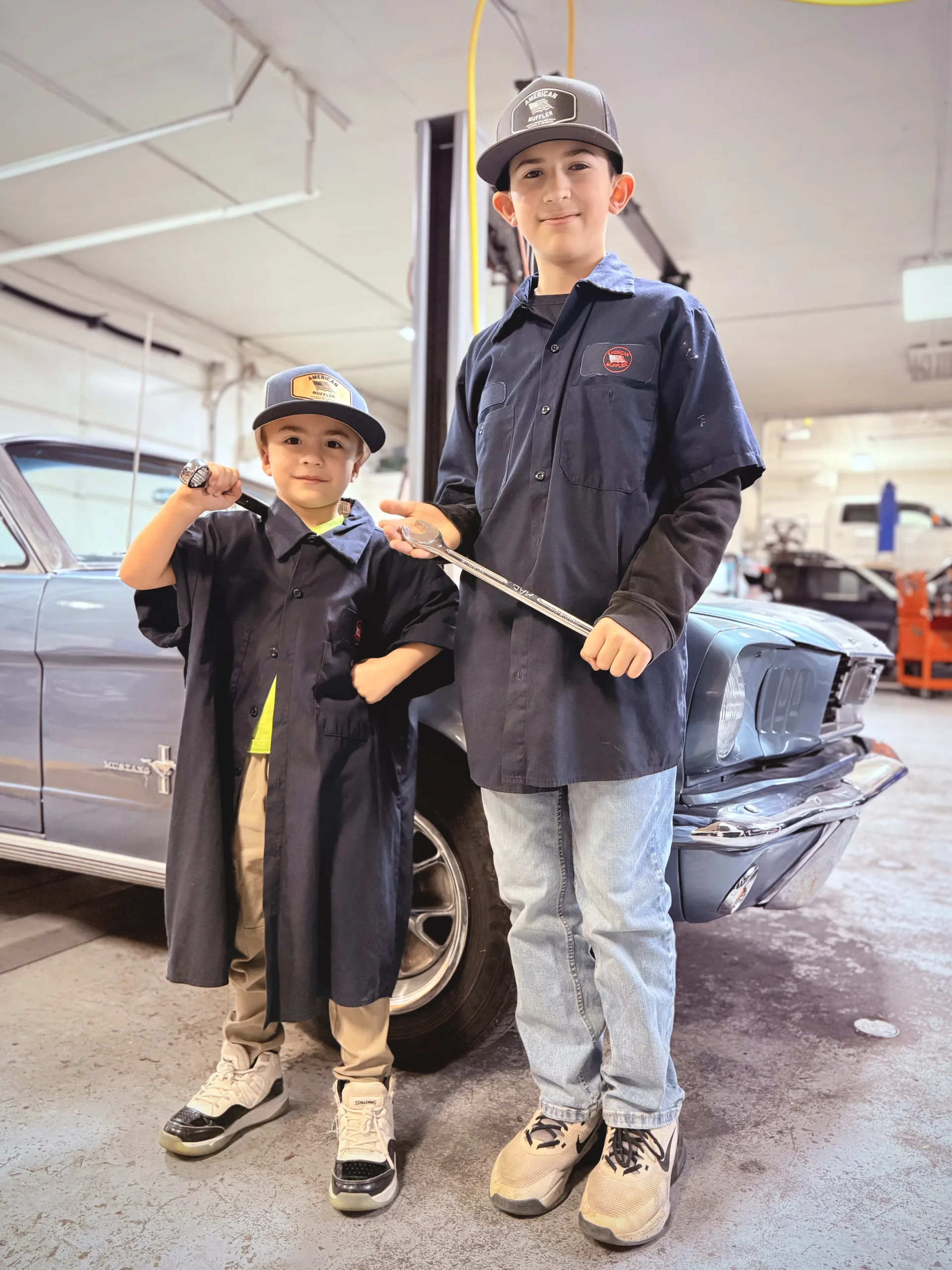 family owned local auto repair with kids at classic mustang