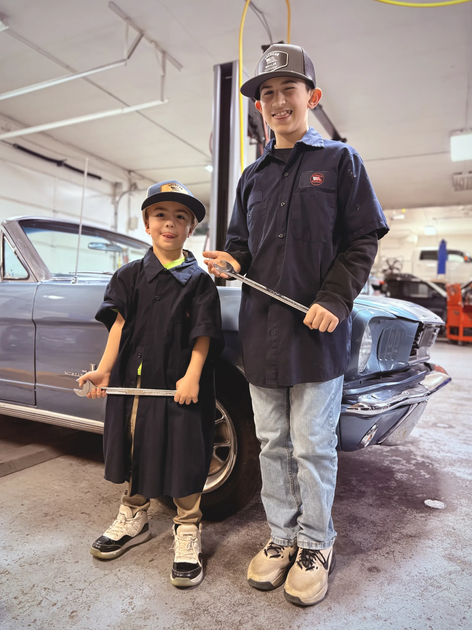 local family auto repair shop young mechanics classic car