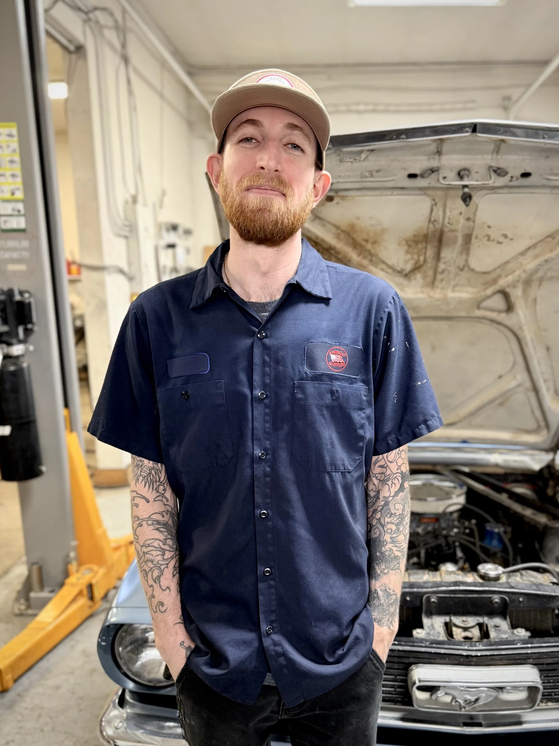 mechanic with classic ford mustang engine repair service