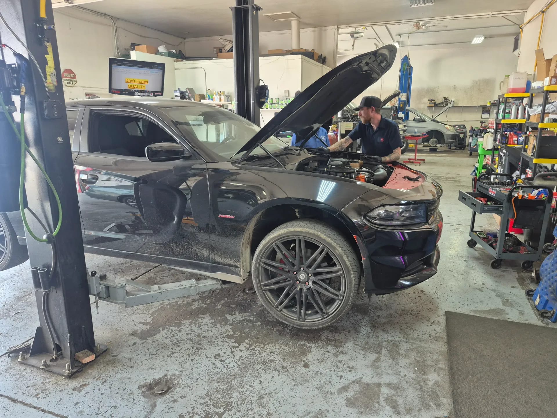 performance car engine diagnostics on shop lift