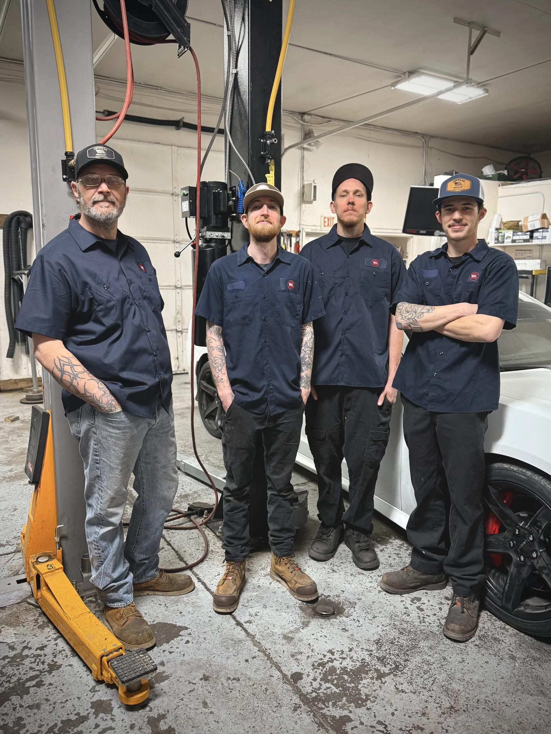 professional auto repair mechanics team in garage