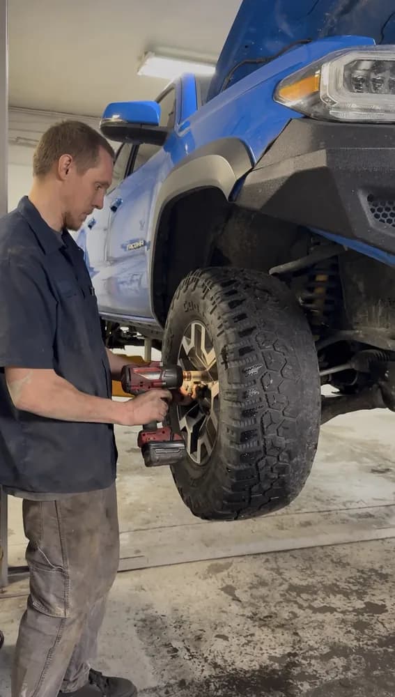 suspension and brake repair on lifted toyota tacoma truck