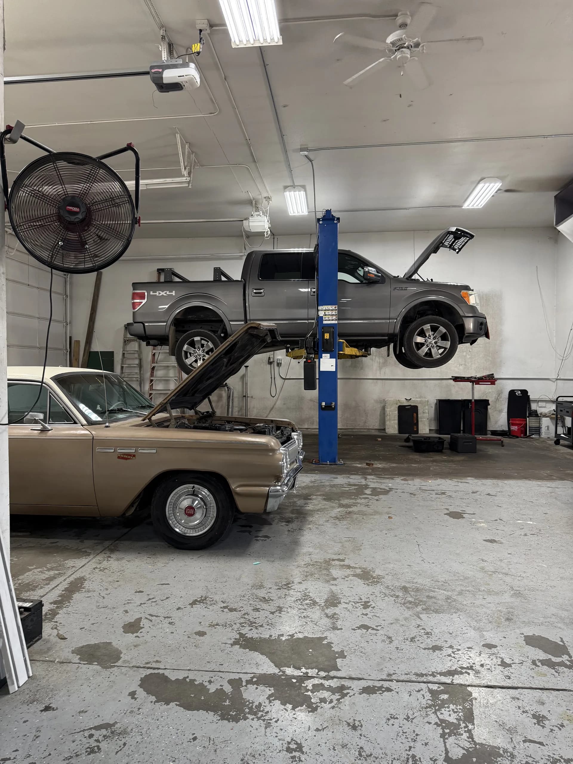 truck and classic car engine repair on shop lift