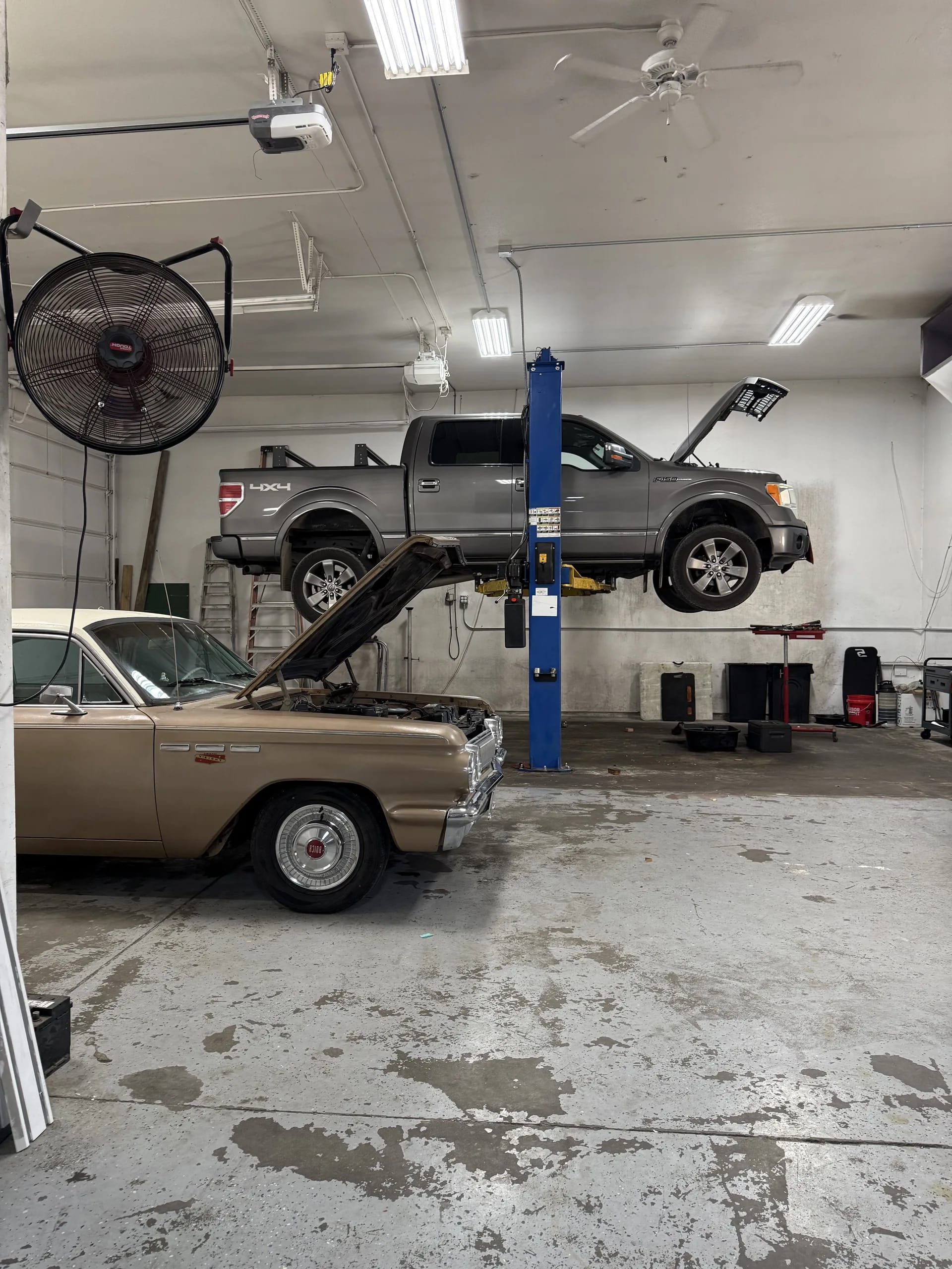truck and classic car engine repair on shop lift